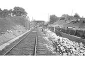 Standing on the single branch line looking back towards the road bridge, beyond which is Claverdon old station
