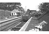 View tshowing the road-side booking office complete whilst work has started on the new footbridge in front of the road bridge