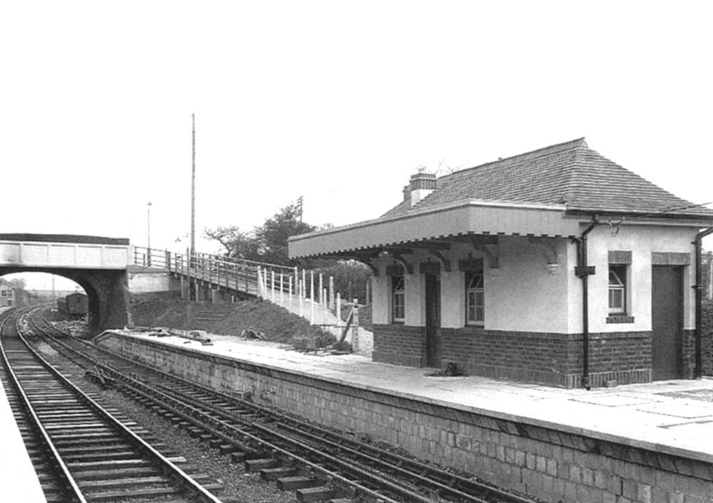 View showing the new down platform waiting room with ramp leading up to the new reinforced concrete footbridge