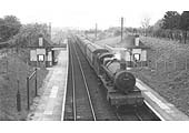 Viewed from the footbridge GWR 4-6-0 No 6851 Hurst Grange starts away from Claverdon for Leamington