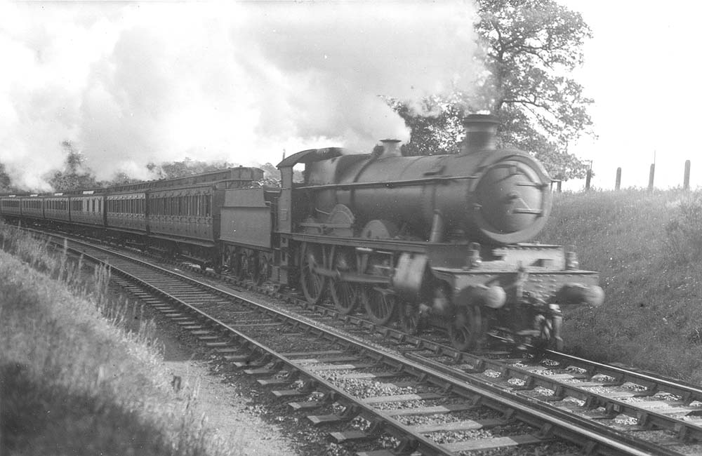 GWR 4-6-0 Saint class No 2903 'Lady of Lyons' is seen at the head of an up express service comprised primarily of clerestory coaching stock