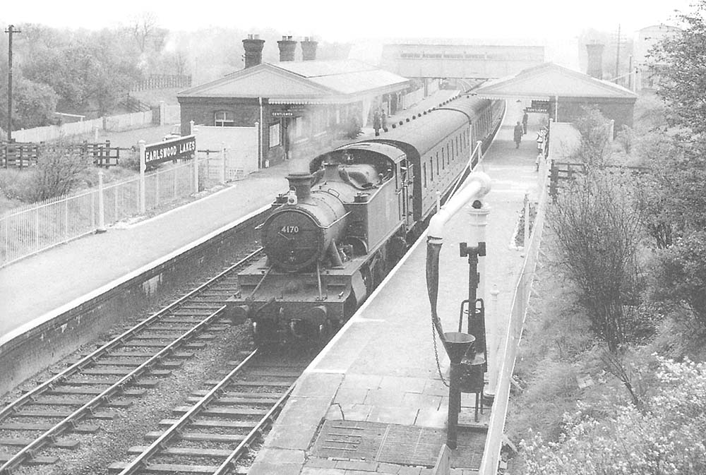 British Railways built 2-6-2T 41xx Class No 4170 arrives at Earlswood Lakes with an up local passenger service for Moor Street in April 1957