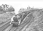 Ex-GWR 4-6-0 No 6922 'Burton Hall' passes the down refuge siding and the  raised upper quadrant signal