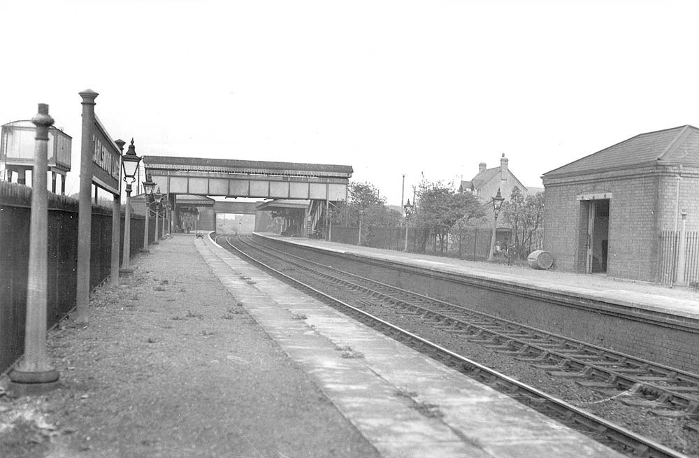 Looking towards Birmingham from the Stratford upon Avon end of the up platform and showing the station's storage shed on the down platform