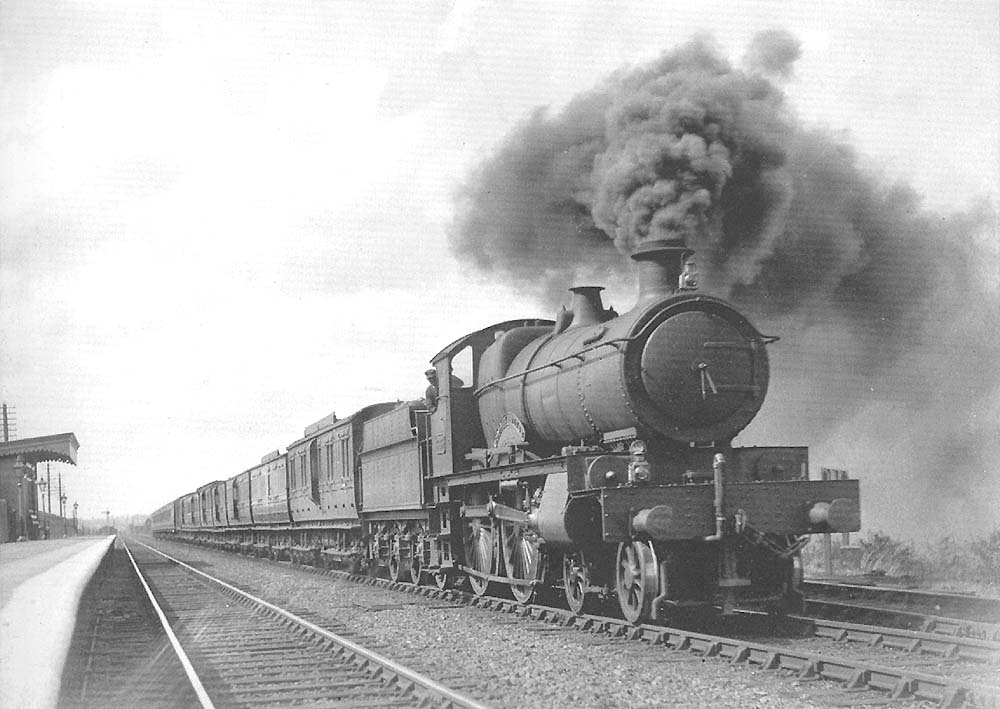 GWR 38xx Class 4-4-0 No 3835 'County of Devon' passes through Fenny Compton on an up express service