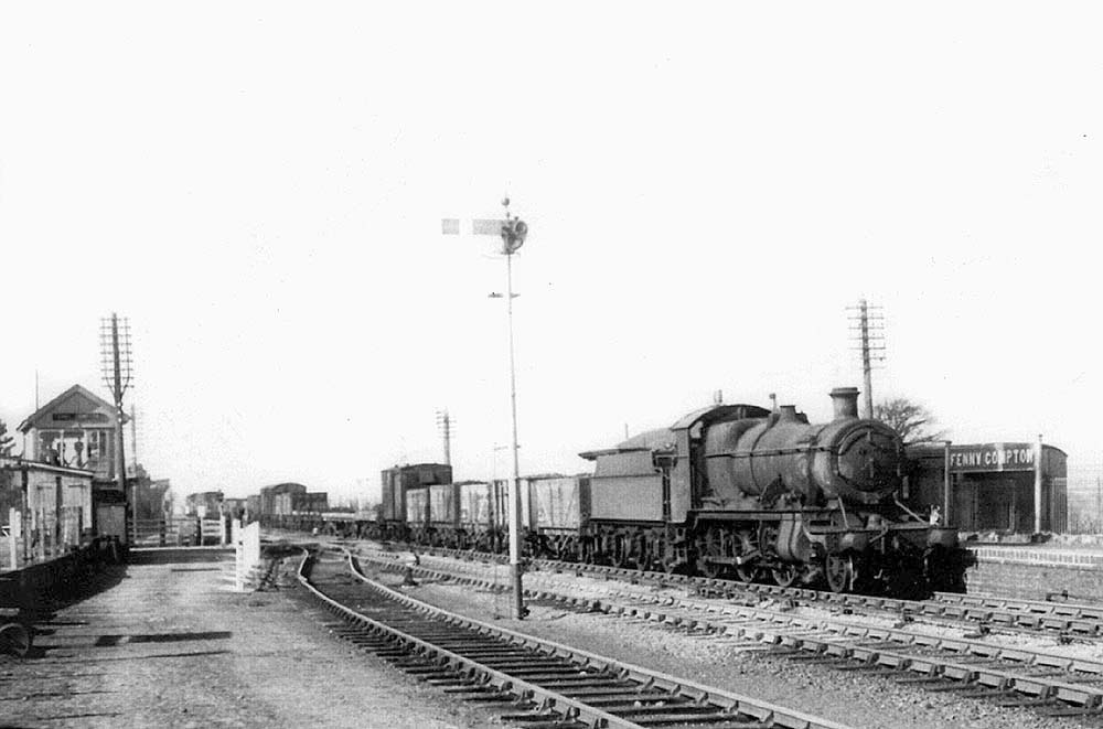 Ex-GWR 53xx Class 2-6-0 No 5317 leaves the up refuge siding at the head of a goods train on 15th March 1952