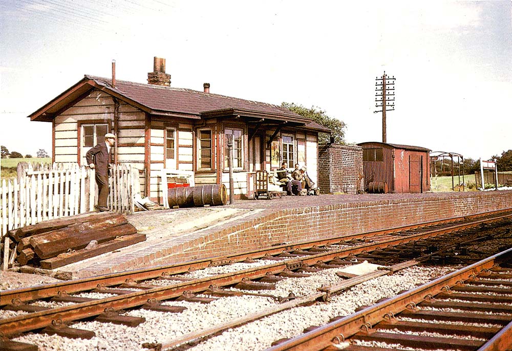Passengers waiting for a local passenger service to Banbury on Fenny Compton station's up platform