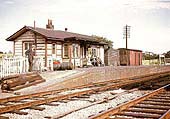 Passengers waiting for a local passenger service to Banbury on Fenny Compton station's up platform