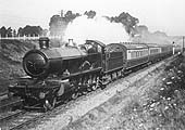An unknown GWR 4-6-0 'Saint' class locomotive is seen passing near Fenny Compton during the 1920s