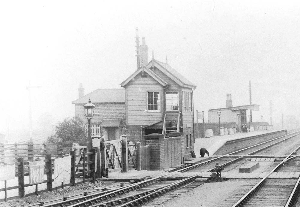 Close up showing the GWR's original signal box at Fenny Compton built between the under bridge and the down platform