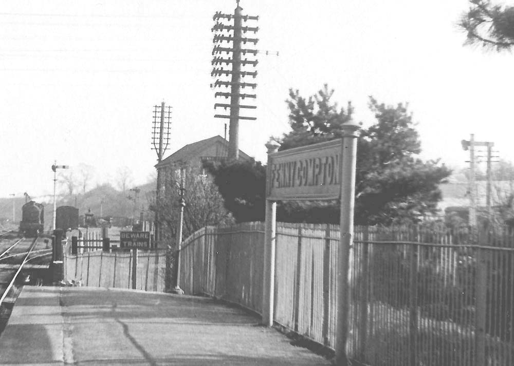 Close up showing a train approaching the joint signal box and the Banbury end of the down platform