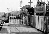 Close up showing a train approaching the joint signal box and the Banbury end of the down platform
