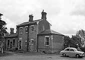 External view of Great Alne station taken circa 1955 showing the vandalised state of the station building after the line's closure