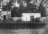 Close up showing the gentlemen's toilet and steel corrugated goods shed situated on the platform