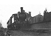 A Great Western Railway 0-4-2T class 48xx locomotive arrives at Great Alne station with an auto trailer