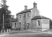 The station buildings and entrance to the goods yard viewed from the Great Alne to Wootton Wawen road