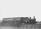 View of Auto trailer No 83 being hauled by an unidentified Collett 48xx class 0-4-2T locomotive