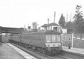 A Derby built three-car Diesel Multiple Unit is seen arriving at Grimes Hill & Wythall station on the 10 35am Stratford upon Avon to Snow Hill service