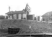 Looking across the two lines towards the building accommodating the Booking Office and the cycle rack to its right