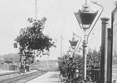 Close up showing the down platform with the signal box at the end of the platform and the lamps blackened for wartime precautions