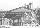 Close up showing Hall Green station's main building, housing the booking offices and waiting rooms, located on the up or Birmingham platform