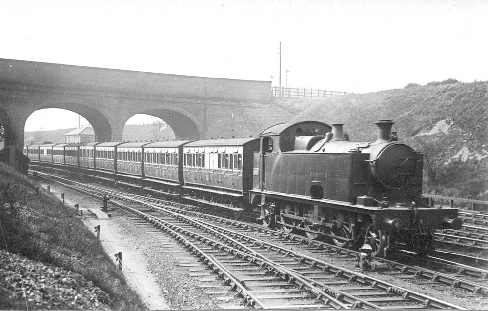 GWR 3101 Class 2-6-2T No 3909 is seen with an up empty stock working comprising of six-wheel coaches