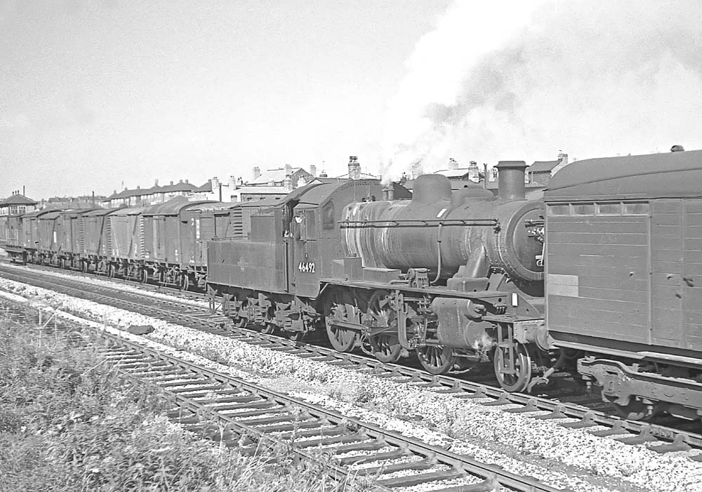 British Railways built 2MT 2-6-0 No 46492 runs tender first through Handsworth and Smethwick station on 26th September 1964
