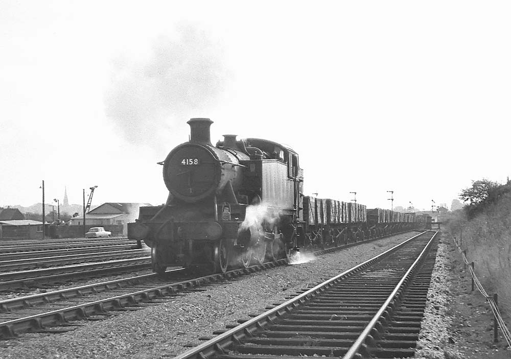Ex-GWR 2-6-2T 5101 Class No 4148 heads a long mineral train near Handsworth and Smethwick station on 26th September 1964