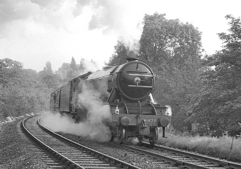 Preserved LNER 4-6-2 A3 No 4472 'Flying Scotsman' passes through Handsworth Park at the head of an enthusiasts special on 12th September 1964