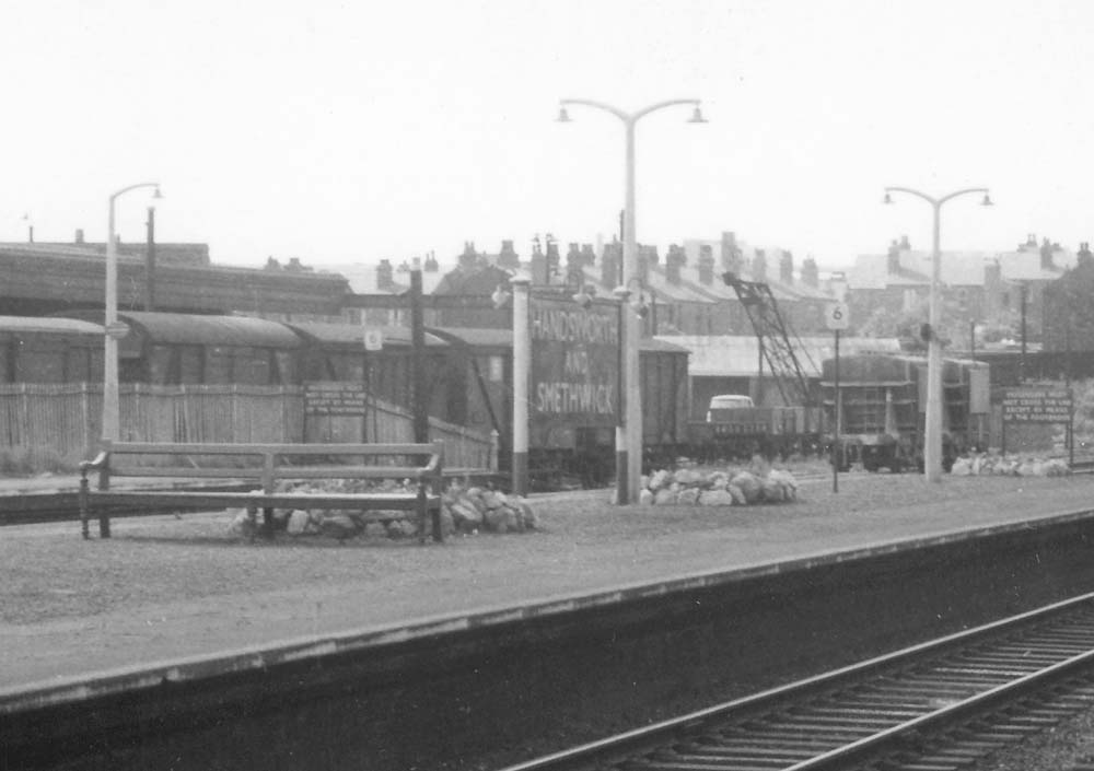 Close up showing Handsworth & Smethwick station's name board repainted in BR maroon and cream livery and the goods yard