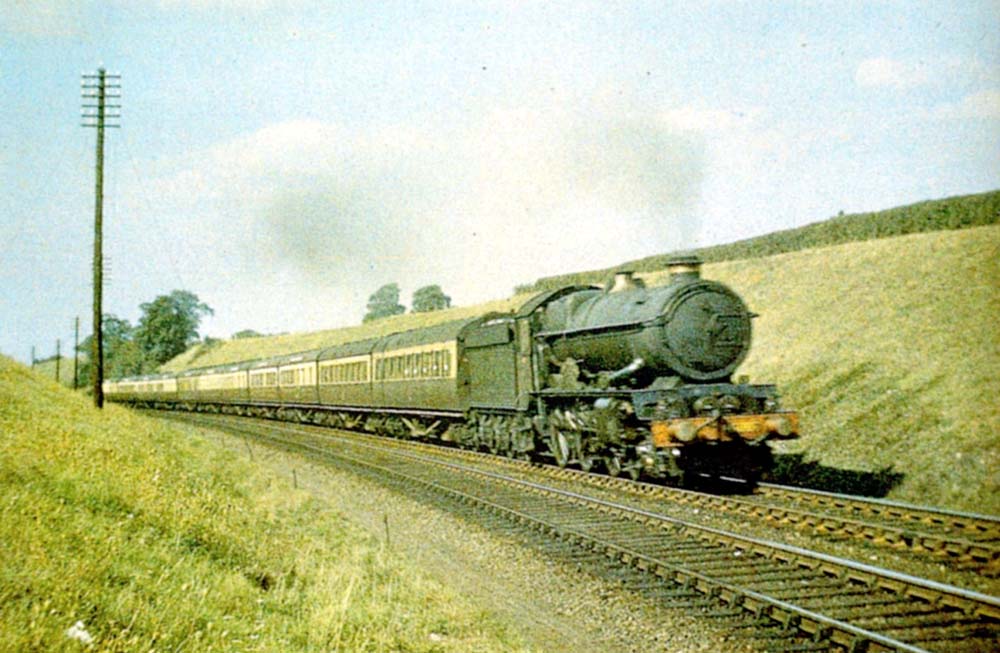 Great Western Railway 4-6-0 60xx ‘King’ class No 6007 ‘King William III’ with a twelve coach southbound express train in Whitnash Cutting