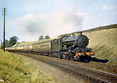 Great Western Railway 4-6-0 60xx �King� class No 6007 �King William III� with a twelve coach southbound express train in Whitnash Cutting