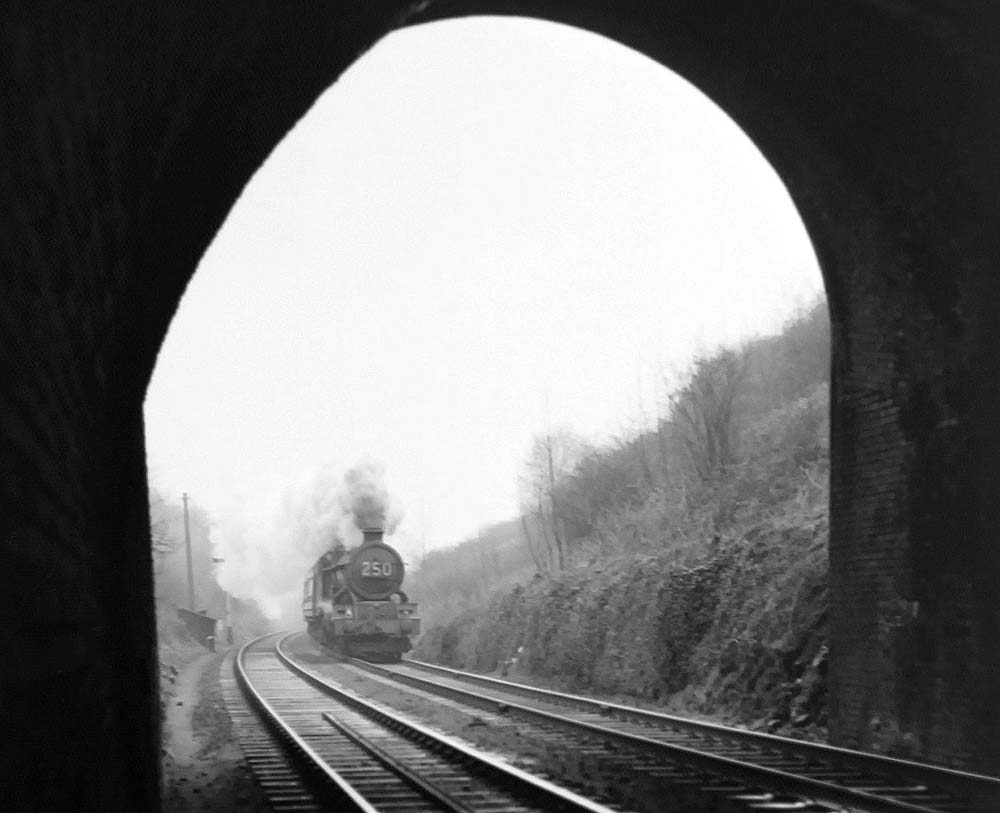 An unidentified ex-GWR 4-6-0 King Class locomotive approaches Harbury Tunnel with a down express service