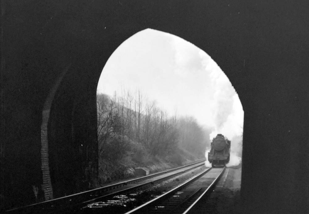 An unidentified ex-LMS 2-8-0 8F locomotive approaches Harbury Tunnel on 9th February 1952