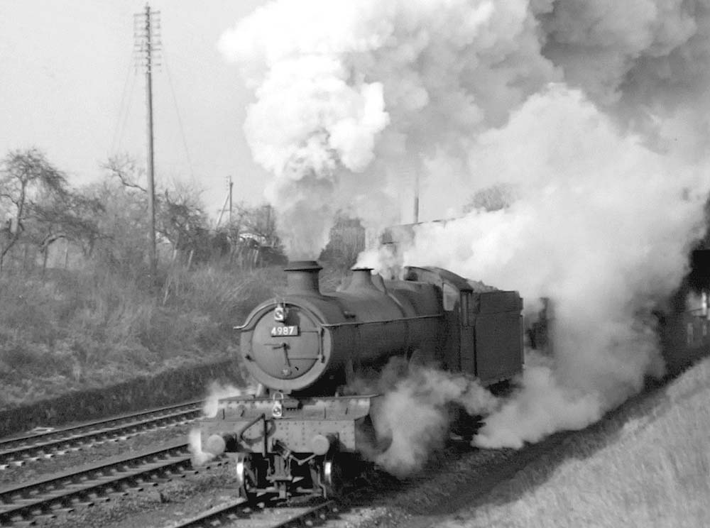 Ex-GWR 4-6-0 Hall Class No 4987 'Brockley Hall' is seen near Harbury on an express service on 9th February 1952