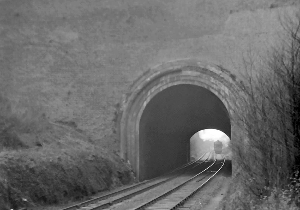 Ex-GWR 4-6-0 King Class No 6008 'King James II' approaches the East end of Harbury tunnel on 9th February 1952