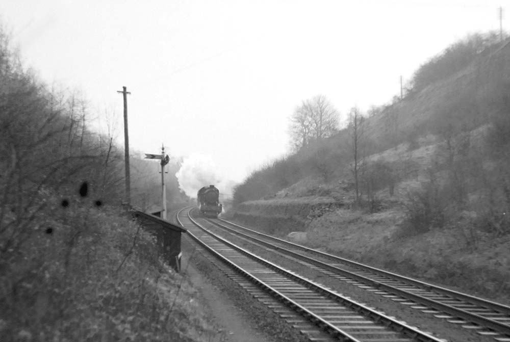 An unidentified ex-GWR Hall Class locomotive approaches the West end of Harbury Tunnel on 9th February 1952