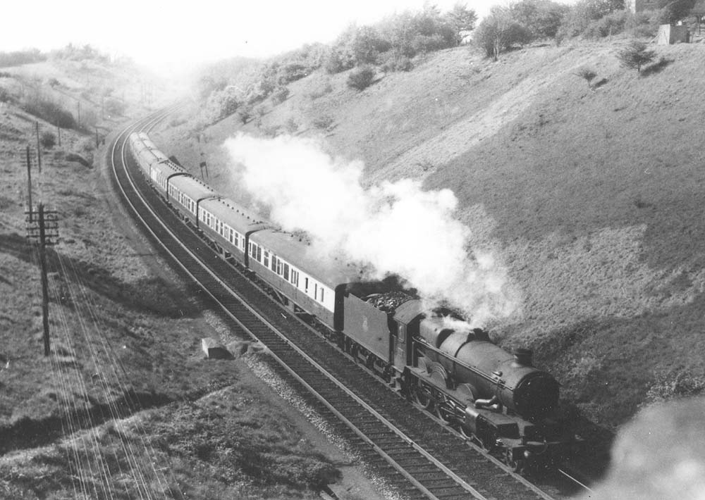 GWR 4-6-0 No 5076 'Gladiator' is seen approaching Harbury Tunnel on an up express