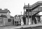 Close up showing the up platform and station sign declaring 'Hatton Junction for Bearley Alcester & Stratford upon Avon'