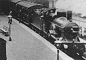 Close up of an unidentified 3031 (Achilles) class 4-2-2 locomotive on a waiting Stratford-upon-Avon train