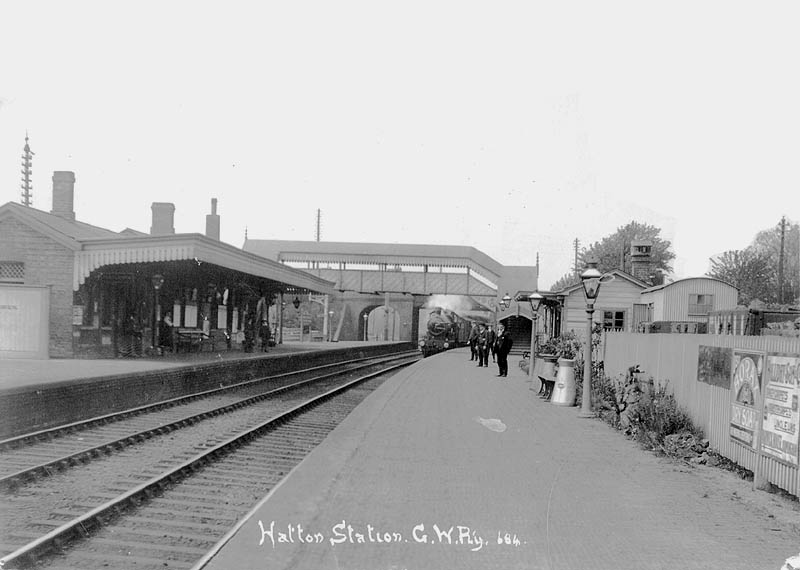 An unidentified GWR double framed 4-4-0 locomotive arrives at Hatton station's up platform circa 1910
