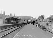 An unidentified GWR double framed 4-4-0 locomotive arrives at Hatton station's up platform circa 1910