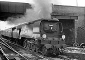 West Country Class 4-6-2 No 34094 'Mortehoe' passes under Station Road bridge at speed on 27th April 1963