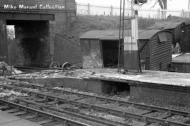 Evidence of an accident at Hatton with damage being sustained to the platform and a derailed covered van in the siding