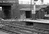 View of an accident at Hatton with damage being sustained to the platform and a derailed covered van in the siding