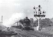 Ex-GWR 4-6-0 No 4092 'Dunraven Castle' passes Hatton North Junction signals whilst at the head of an up express service