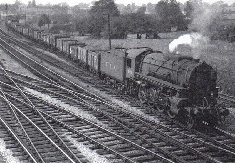 United States Army Transport Corps S120 Class 2-8-0 No 2138 leaves the up loop refuge siding with a long coal train