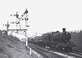 Ex-GWR 2-8-0 No 3515 proceeds past Hatton West signal box with a train for Stratford on Avon in 1950