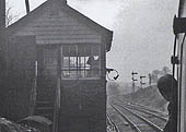 A DMU driver on a service to Stratford on Avon is about to exchange the token with the signalman from Hatton West Signal Box