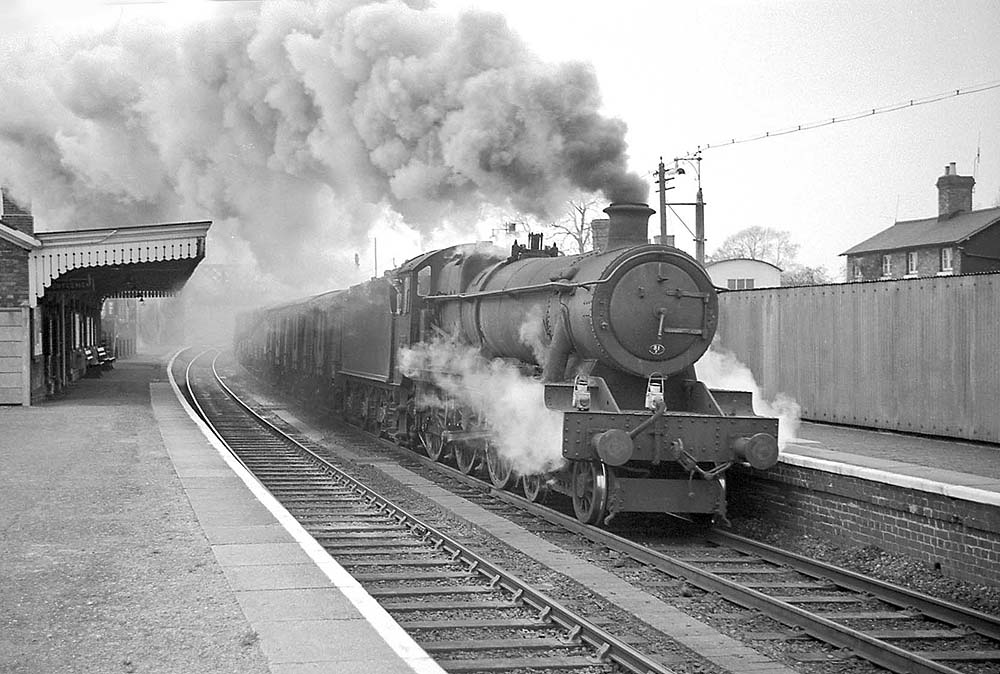 Ex-GWR 4-6-0 Hall Class No 6974 'Bryngwyn Hall' runs southbound through Hatton with an up freight on 20th April 1965